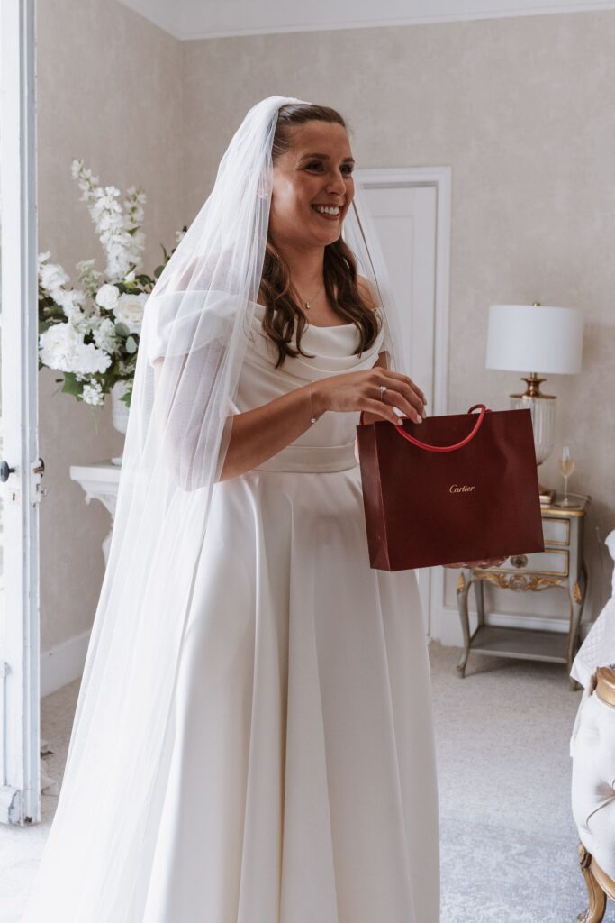 A bride receives a Cartier bracelet as a heartfelt gift before making her way down the aisle